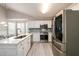 Kitchen featuring stainless steel appliances, an eat-in dining space, and bright lighting at 7090 Valley Landing Ct, Cumming, GA 30041