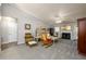 Spacious living room with a fireplace, neutral carpet, and ample natural light at 7090 Valley Landing Ct, Cumming, GA 30041