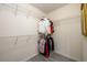 Spacious walk-in closet with ample storage, wire shelving, and contemporary gray wood flooring at 7090 Valley Landing Ct, Cumming, GA 30041