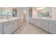 Bathroom boasts double vanities and abundant storage with pristine white cabinets at 146 Himalaya Way, Mcdonough, GA 30253