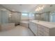 A luxurious bathroom featuring a glass shower, soaking tub, and double vanity at 146 Himalaya Way, Mcdonough, GA 30253