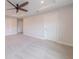 Spacious bedroom with neutral carpet, ceiling fan, and ensuite access at 146 Himalaya Way, Mcdonough, GA 30253