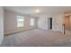 Bright bedroom with two large windows and plush carpeting at 146 Himalaya Way, Mcdonough, GA 30253