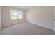 A bright, cozy bedroom featuring neutral paint, carpet and a sunlit window at 146 Himalaya Way, Mcdonough, GA 30253
