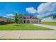 Inviting two-story home with a well-manicured lawn and attractive exterior finishes at 146 Himalaya Way, Mcdonough, GA 30253