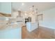 Bright kitchen with white countertops, modern appliances, and hardwood flooring at 146 Himalaya Way, Mcdonough, GA 30253