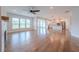 Open living room with hardwood floors and access to a modern kitchen at 146 Himalaya Way, Mcdonough, GA 30253