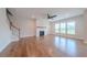 Cozy living room featuring a fireplace, hardwood floors, and ample natural light at 146 Himalaya Way, Mcdonough, GA 30253