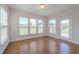 Bright sunroom with hardwood floors and multiple windows for natural light at 146 Himalaya Way, Mcdonough, GA 30253