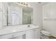 Bathroom with a shower, white sink, toilet, and towel hangers at 2379 Fallbrook Ct, Duluth, GA 30096