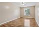 Bedroom with hardwood floors, a window, and neutral paint at 2379 Fallbrook Ct, Duluth, GA 30096
