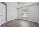 Bedroom showcasing hardwood floors, a ceiling fan, and a window at 2379 Fallbrook Ct, Duluth, GA 30096