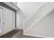 Bright foyer with white staircase, neutral walls, and wood-look flooring by the entry door at 2379 Fallbrook Ct, Duluth, GA 30096