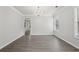 Spacious living room features neutral paint, chandelier, and new floors at 2379 Fallbrook Ct, Duluth, GA 30096