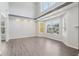 Open living room with a high ceiling, recessed lights, and big windows at 2379 Fallbrook Ct, Duluth, GA 30096