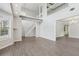Bright living room with hardwood floors, high ceilings, white stairs and access to the backyard at 2379 Fallbrook Ct, Duluth, GA 30096
