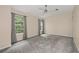 Bright bedroom with neutral walls, carpet, a ceiling fan and a double window with curtains at 2680 Pine Tree Ne Rd # 2, Atlanta, GA 30324