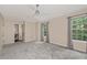 Bedroom with neutral walls, carpet, a ceiling fan and a double window with curtains, next to the bathroom at 2680 Pine Tree Ne Rd # 2, Atlanta, GA 30324