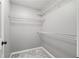 Walk-in closet with white shelving and gray carpet at 2680 Pine Tree Ne Rd # 2, Atlanta, GA 30324