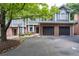 Charming townhome with brick accents, attached garages, well-kept landscaping and inviting curb appeal at 2680 Pine Tree Ne Rd # 2, Atlanta, GA 30324