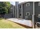 Charming townhome exterior with a fenced patio and well-maintained lawn at 2680 Pine Tree Ne Rd # 2, Atlanta, GA 30324