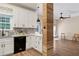 Charming kitchen boasts bright white cabinets, modern appliances, and adjacent access to outdoor at 2680 Pine Tree Ne Rd # 2, Atlanta, GA 30324