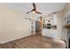 Open concept featuring modern flooring, view to the kitchen and stylish barn door at 2680 Pine Tree Ne Rd # 2, Atlanta, GA 30324