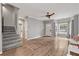 Open living room with wood floors, staircase, and natural light at 2680 Pine Tree Ne Rd # 2, Atlanta, GA 30324