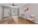 Spacious living room featuring a ceiling fan, wood floors and bright natural light at 2680 Pine Tree Ne Rd # 2, Atlanta, GA 30324
