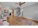 Bright living room with modern ceiling fan, wood floors, and a staircase at 2680 Pine Tree Ne Rd # 2, Atlanta, GA 30324