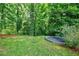 A sunken trampoline sits in the lush, green backyard at 510 Heards Ferry Rd, Atlanta, GA 30328