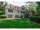 Backyard view of the home with a manicured lawn at 510 Heards Ferry Rd, Atlanta, GA 30328