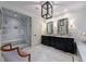 Luxurious bathroom featuring a glass-enclosed shower, double vanities, and elegant fixtures for a spa-like experience at 510 Heards Ferry Rd, Atlanta, GA 30328