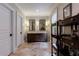 Bathroom featuring a double vanity, storage shelves, and neutral tones, creating a calming space at 510 Heards Ferry Rd, Atlanta, GA 30328