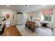 Charming bedroom featuring striped walls, a comfortable bed, and ample natural light at 510 Heards Ferry Rd, Atlanta, GA 30328