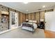 Stylish bedroom with patterned wallpaper, a cozy bed, and an ensuite bathroom at 510 Heards Ferry Rd, Atlanta, GA 30328
