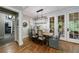 Inviting dining room with French doors, hardwood floors, and modern lighting at 510 Heards Ferry Rd, Atlanta, GA 30328