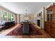 Elegant dining room featuring a fireplace, large windows, and hardwood floors at 510 Heards Ferry Rd, Atlanta, GA 30328