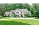 Beautiful two-story traditional style home with a well-manicured lawn and circular driveway at 510 Heards Ferry Rd, Atlanta, GA 30328