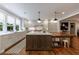 Spacious kitchen features a large island with marble countertop and stylish pendant lighting at 510 Heards Ferry Rd, Atlanta, GA 30328