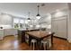 Well-appointed kitchen with a large island featuring a dining table extension and modern appliances at 510 Heards Ferry Rd, Atlanta, GA 30328