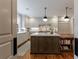 Gourmet kitchen with a center island, modern appliances, and a breakfast nook at 510 Heards Ferry Rd, Atlanta, GA 30328
