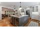 Kitchen island boasts seating, wine cooler, and plenty of storage and prep space at 510 Heards Ferry Rd, Atlanta, GA 30328