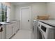 Well-organized laundry room with marble countertops, modern machines, and ample storage at 510 Heards Ferry Rd, Atlanta, GA 30328