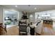 Open-concept living room with hardwood floors flows into the modern kitchen with a large island at 510 Heards Ferry Rd, Atlanta, GA 30328