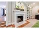 Close-up of the living room fireplace, showcasing the marble surround and detailed mantel at 510 Heards Ferry Rd, Atlanta, GA 30328