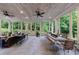 Relaxing sunroom with stone floors, fireplace and walls of windows at 510 Heards Ferry Rd, Atlanta, GA 30328