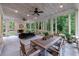 Entertain in this relaxing sunroom with stone floors, fireplace and walls of windows at 510 Heards Ferry Rd, Atlanta, GA 30328