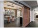 This wine cellar features a modern design with a glass enclosure, a counter with barstools, and a sliding barn door entry at 510 Heards Ferry Rd, Atlanta, GA 30328