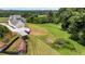 Panoramic aerial view of the property showcasing the home, garage, and sprawling green land at 5315 Hendrix Rd, Cumming, GA 30040